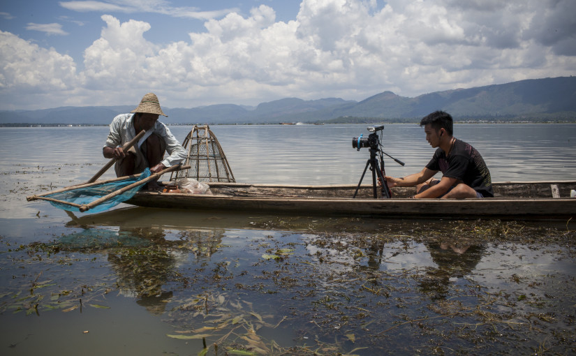 Natalie Keyssar Burma.jpg: "Myanmar Telling Its Own Story" reporting fellow Johnny Wu films a Burmese fisherman on Inle Lake in 2013. (Natalie Keyssar/GroundTruth)